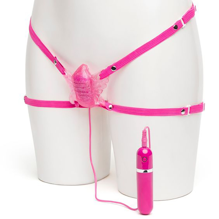 A pink panty vibrator shaped like a butterfly, with four straps and a small bullet vibrator