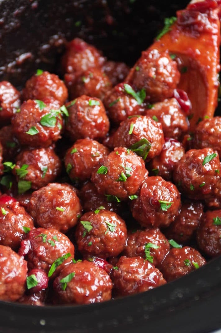 STYLECASTER | 12 Holiday Appetizers You Can Make in a Slow Cooker | Sweet and Tangy Cranberry Meatballs